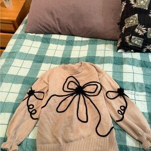Women’s size large Cupshe Elegant Beige Sweater with Black Bow Design